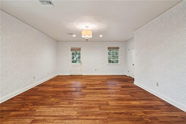 spare room with dark hardwood / wood-style flooring