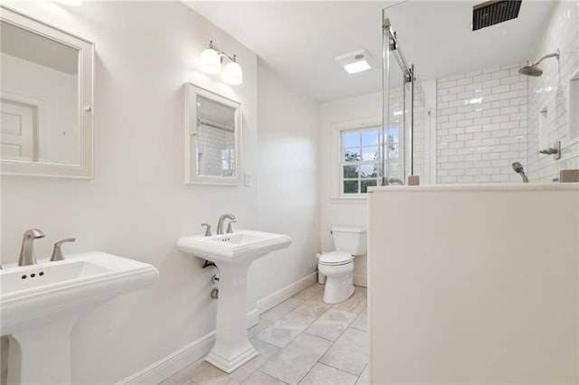 bathroom featuring sink and toilet