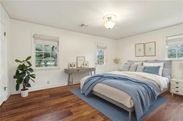 bedroom featuring dark hardwood / wood-style flooring