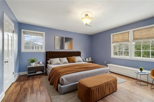 bedroom with hardwood / wood-style flooring