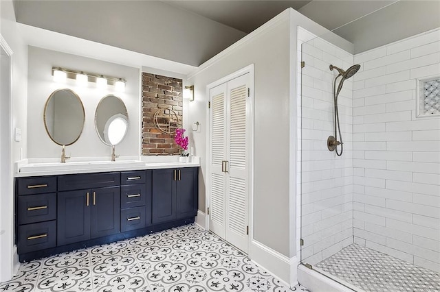 bathroom with a sink, tile patterned flooring, double vanity, a stall shower, and a closet