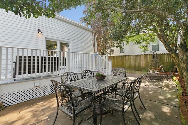 view of patio / terrace featuring fence and outdoor dining space