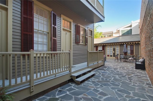 view of side of property with a patio area