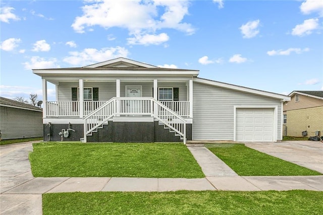 view of front of home featuring a garage, covered porch, and a front lawn