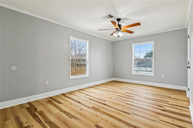 empty room with crown molding, ceiling fan, and light wood-type flooring