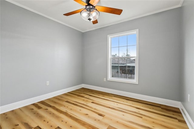 empty room featuring crown molding, ceiling fan, and hardwood / wood-style flooring