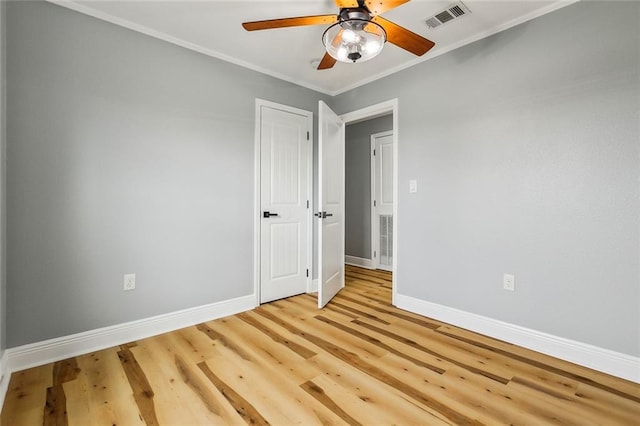 unfurnished room with ceiling fan, ornamental molding, and light hardwood / wood-style floors