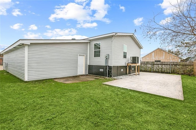 back of property featuring a yard, central AC, and a patio area