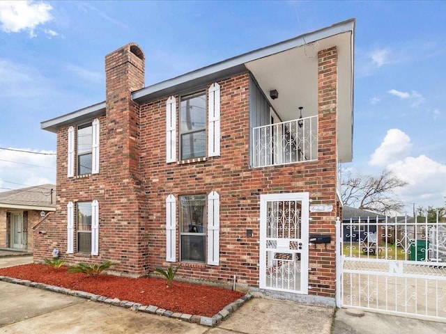 view of front of property with a balcony