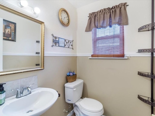 bathroom with toilet and sink