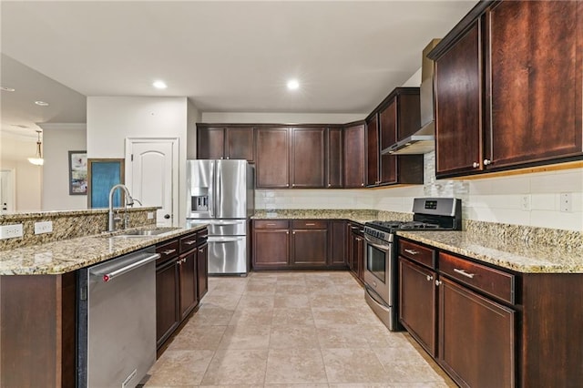 kitchen with stainless steel appliances, light stone countertops, sink, and decorative backsplash