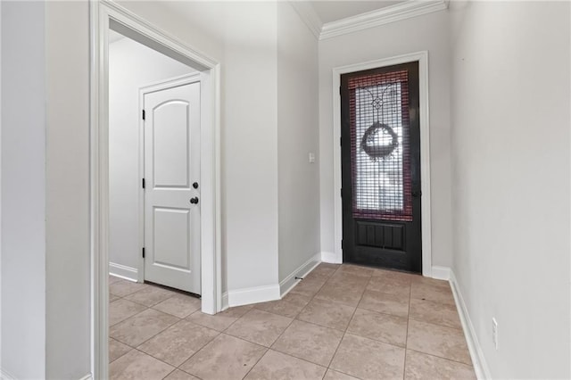 tiled foyer entrance featuring ornamental molding