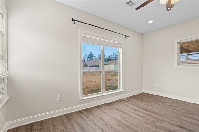 spare room featuring hardwood / wood-style flooring and ceiling fan