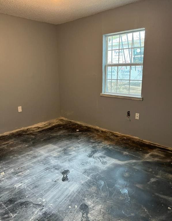 empty room with a textured ceiling