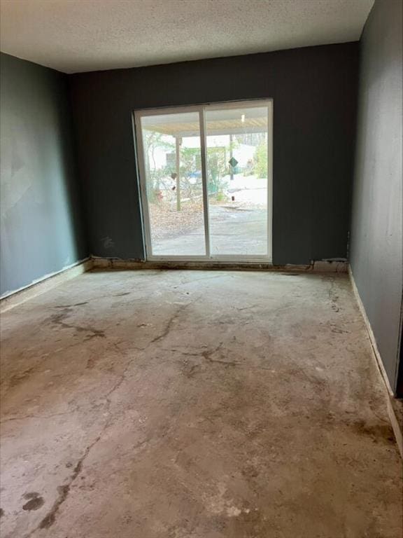 empty room featuring a textured ceiling