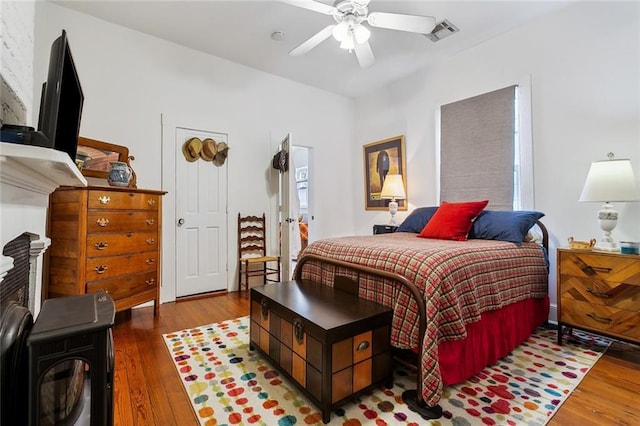 bedroom featuring dark hardwood / wood-style floors and ceiling fan