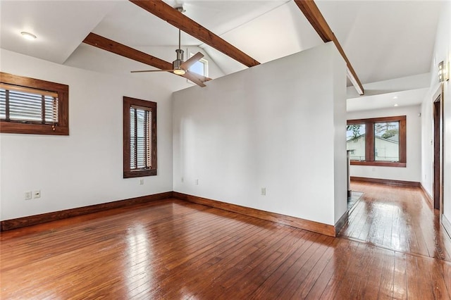 empty room with ceiling fan, hardwood / wood-style floors, and vaulted ceiling with beams