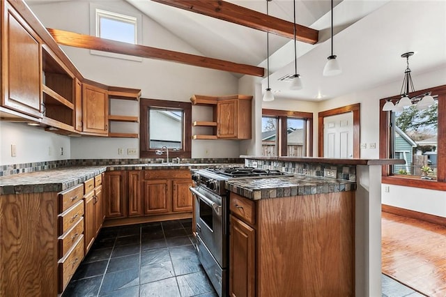 kitchen featuring high end stainless steel range oven, a healthy amount of sunlight, decorative light fixtures, and a kitchen breakfast bar