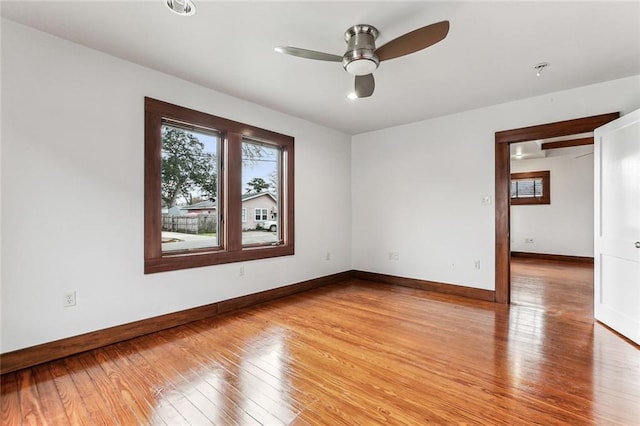 spare room featuring ceiling fan and light wood-type flooring