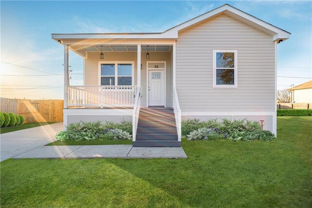 26 Carroll Dr, Chalmette, LA 70043 - view of front of home featuring covered porch