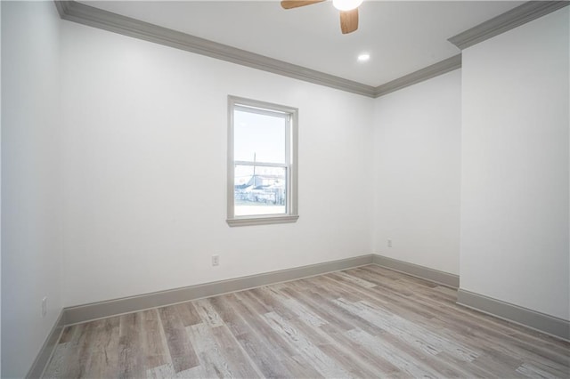 empty room featuring ceiling fan, ornamental molding, and light hardwood / wood-style floors