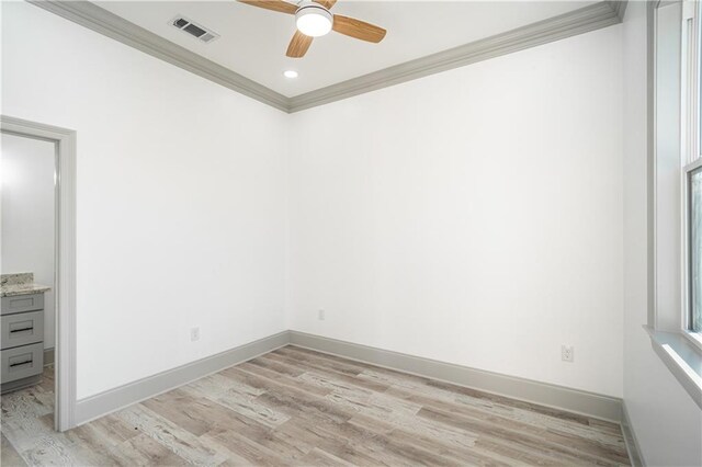 empty room featuring crown molding, light hardwood / wood-style flooring, and ceiling fan