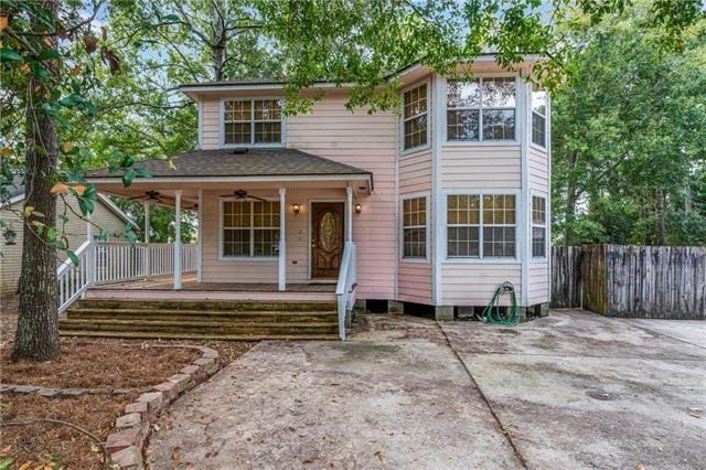 view of front of home with a porch, ceiling fan, and a patio area