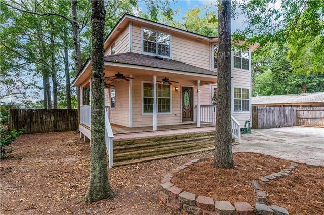 view of front of property with a patio area, ceiling fan, and a porch