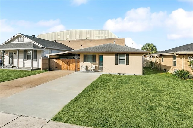 rear view of property featuring a yard