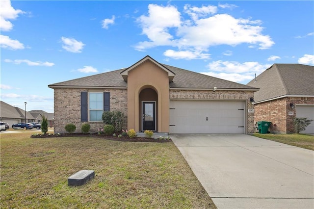 view of front of home featuring a garage and a front yard