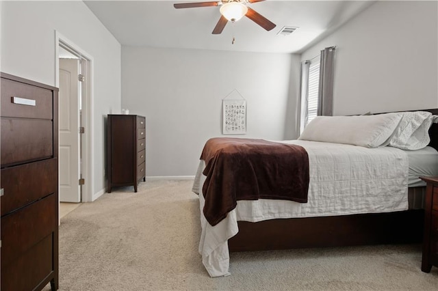 bedroom featuring light carpet and ceiling fan