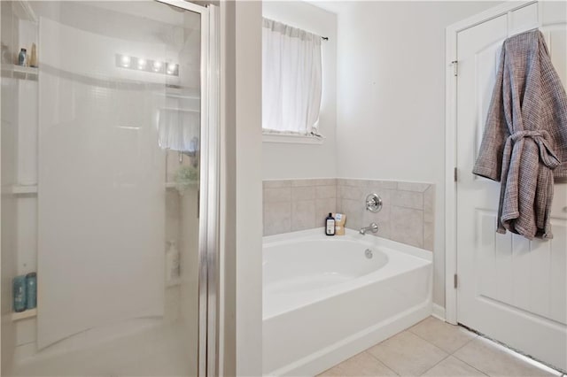 bathroom with tile patterned flooring and independent shower and bath