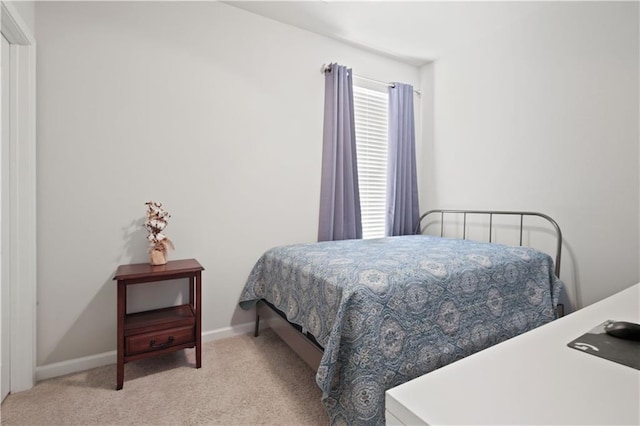 bedroom featuring light colored carpet