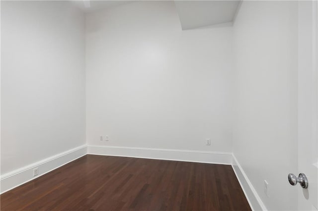 unfurnished room featuring dark hardwood / wood-style floors