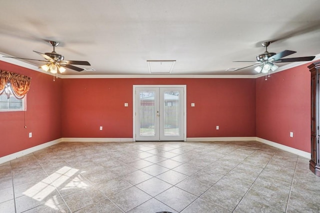 spare room with a ceiling fan, french doors, crown molding, and baseboards