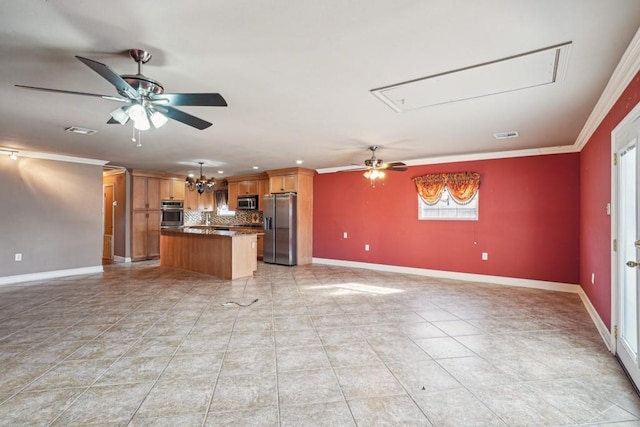 kitchen featuring stainless steel appliances, open floor plan, ornamental molding, backsplash, and a center island