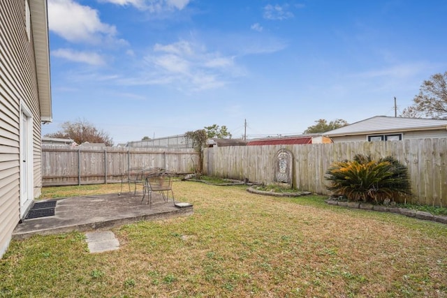 view of yard with a patio and a fenced backyard