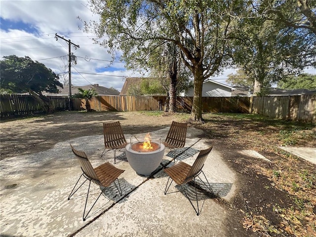 view of patio with a fire pit