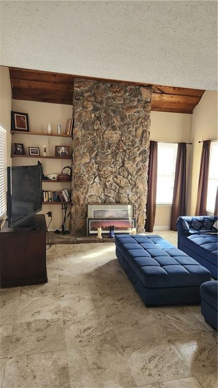 living room featuring wood ceiling, a textured ceiling, and vaulted ceiling with beams