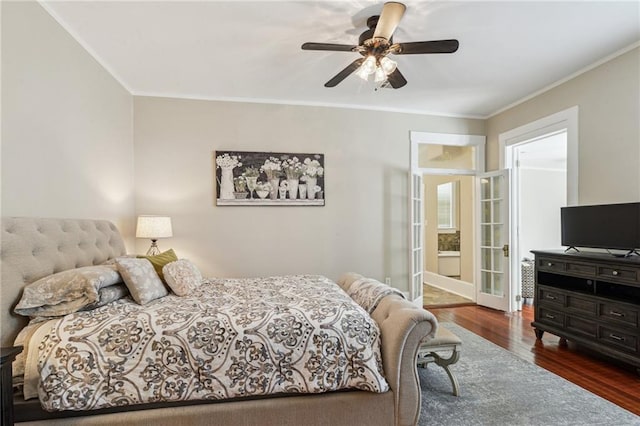 bedroom with dark hardwood / wood-style flooring, ornamental molding, and ceiling fan