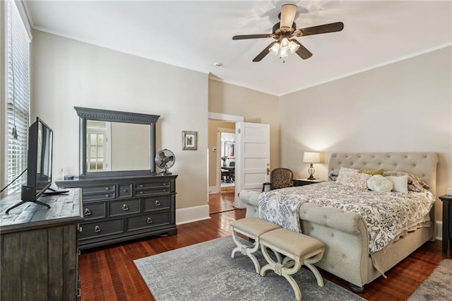 bedroom with ceiling fan and dark hardwood / wood-style floors