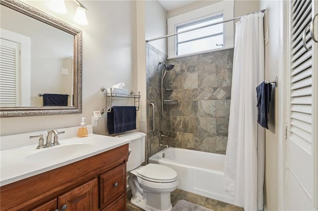 full bathroom with shower / bath combo, vanity, and toilet