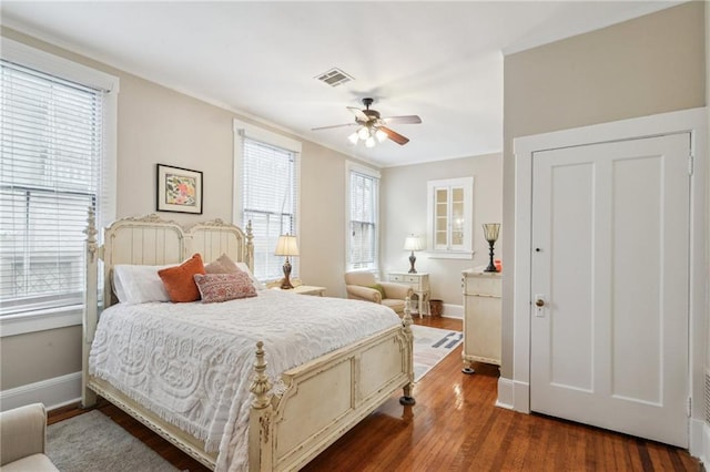 bedroom featuring dark hardwood / wood-style floors and ceiling fan