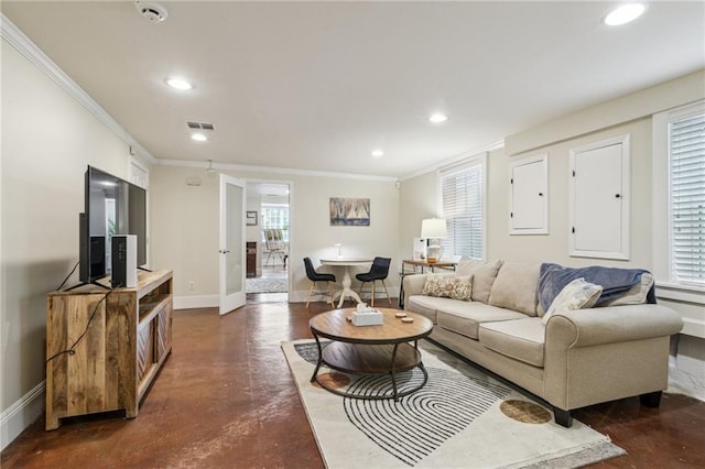 living room with ornamental molding and a wealth of natural light