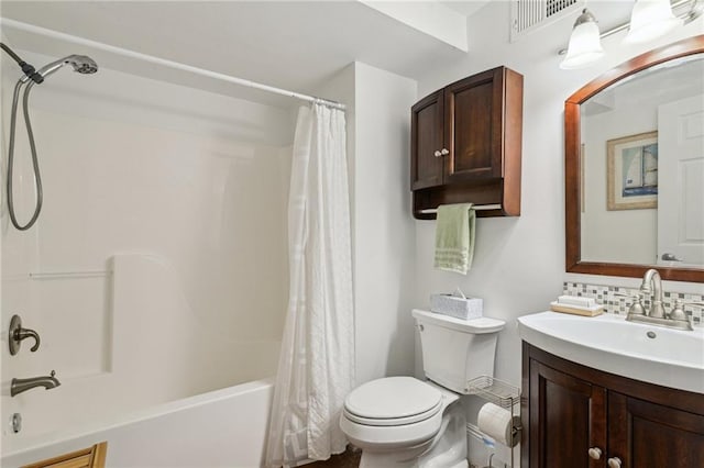 full bathroom featuring shower / bath combination with curtain, vanity, toilet, and backsplash