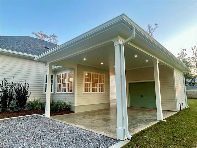 view of side of property with a carport