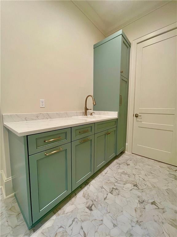 bathroom featuring crown molding and vanity