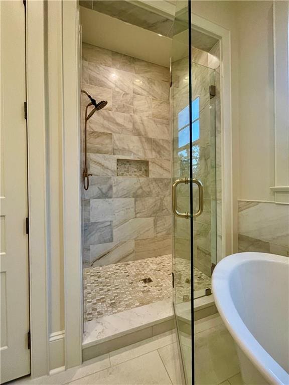 bathroom with independent shower and bath