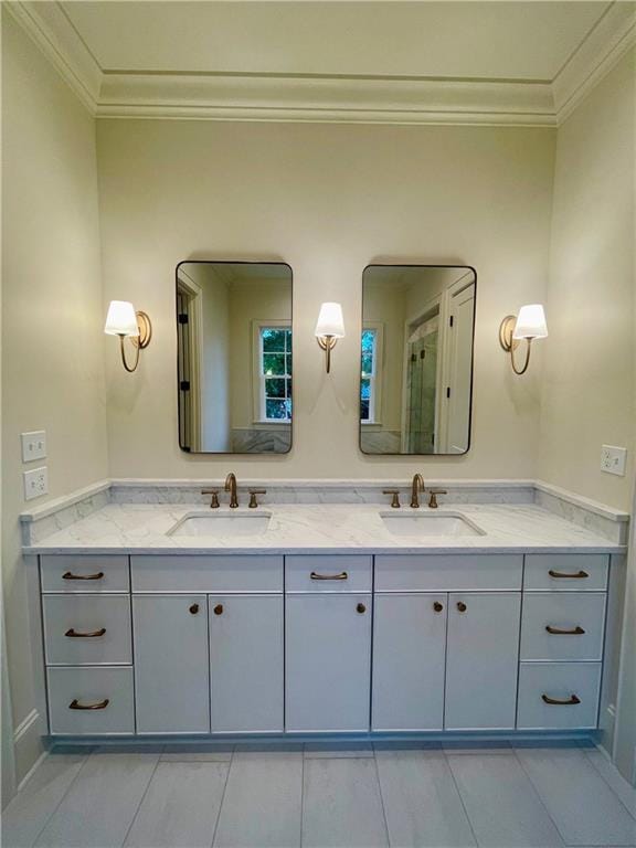 bathroom with crown molding and vanity