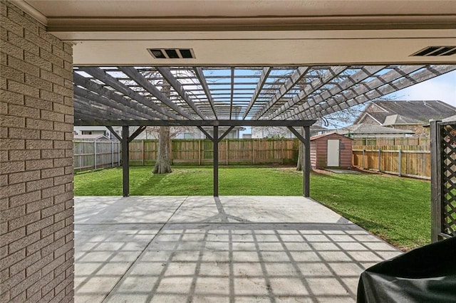 view of patio / terrace with a pergola and a shed